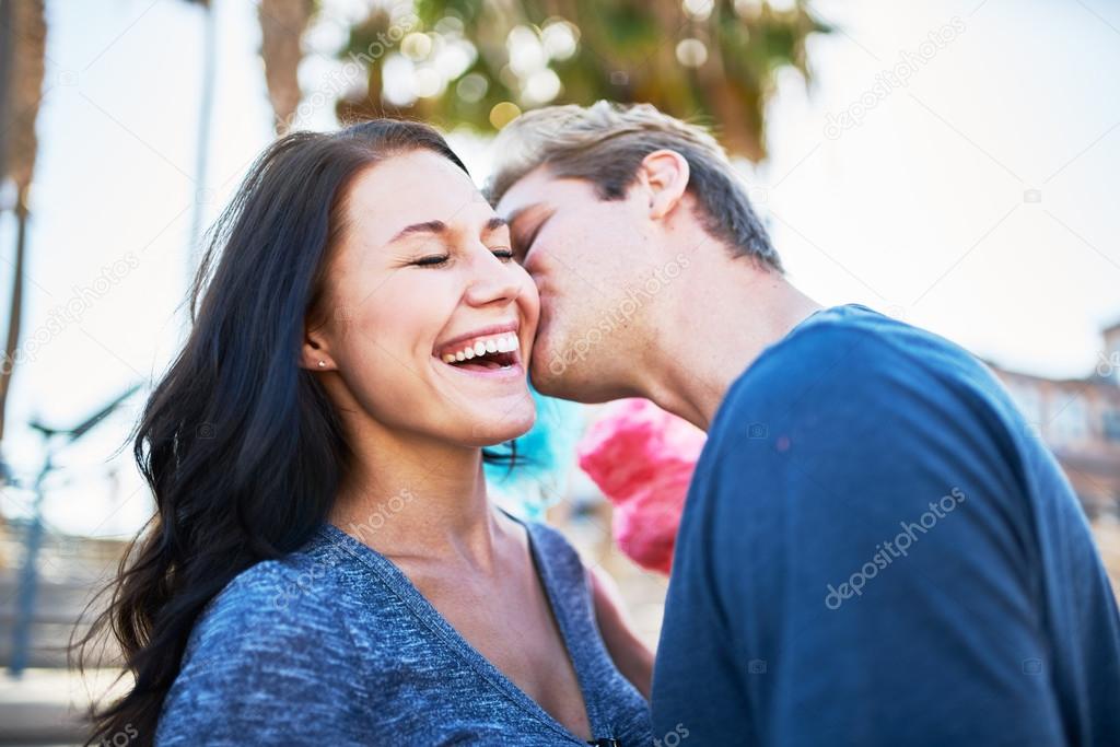 boyfriend giving surprise kiss