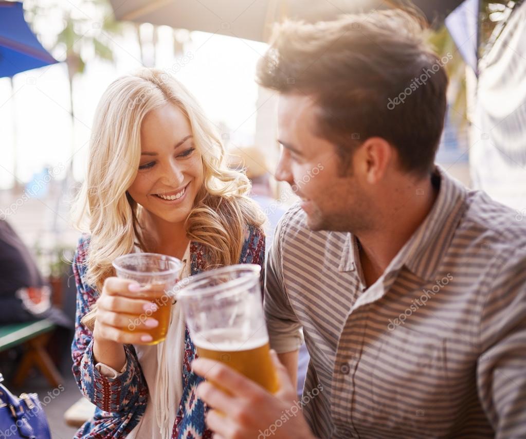 romantic couple drinking beer