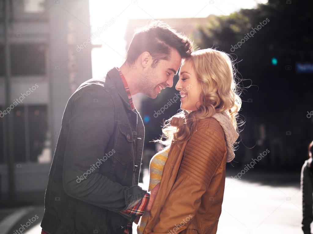 couple on street in city flirting 