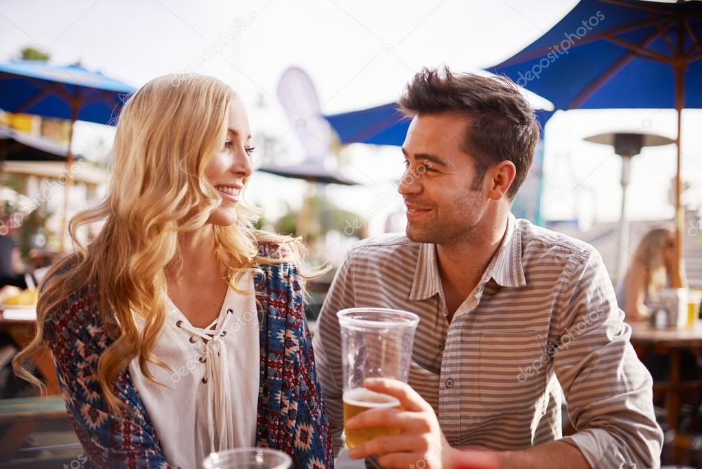 couple drinking beer in beach side