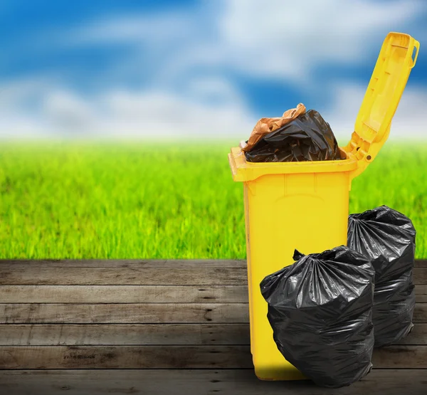 Garbage bins ecology concept on old wood — Stock Photo, Image