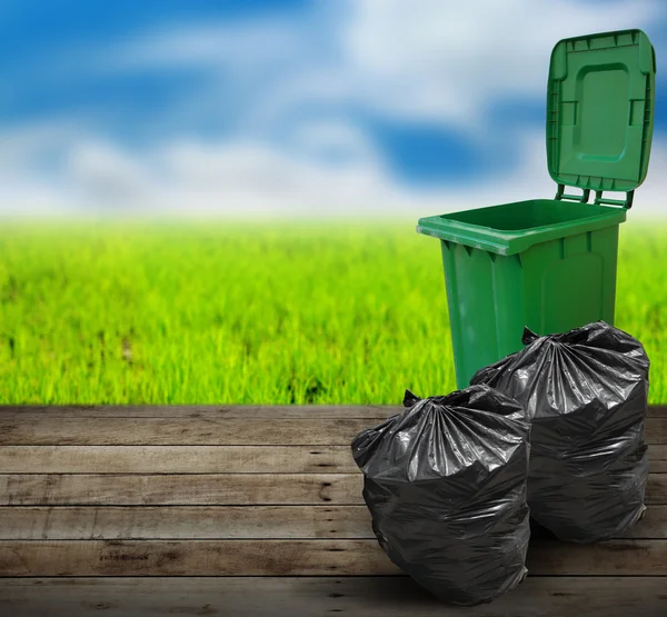 Garbage bins ecology concept on old wood — Stock Photo, Image