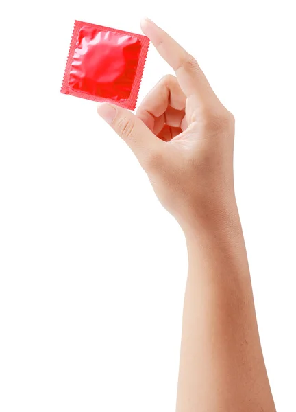 Czerwony prezerwatywy w ręce kobiece kobieta na białym tle biały ze ścieżką przycinającą — Zdjęcie stockowe