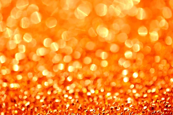 Lichten en oranje op goud met bokeh achtergrond wazig — Stockfoto