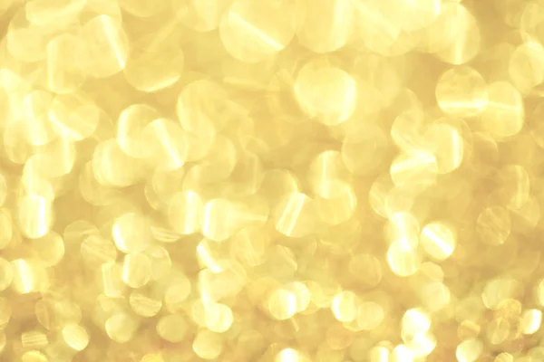 Lichter verschwimmen auf Gold mit Bokeh-Hintergrund. — Stockfoto