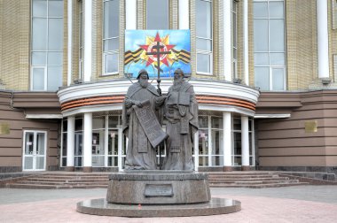 Saratov, Russia - May 06, 2015:  Monument to Kirill and Mefodiy at the building of the Saratov State University.