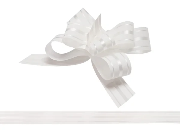 Shiny white satin ribbon on white background — Stock Photo, Image