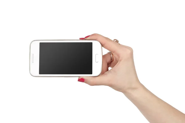 Woman showing white smartphone in hand. Isolated background. Phone with pure black gradient screen. — Stock Photo, Image