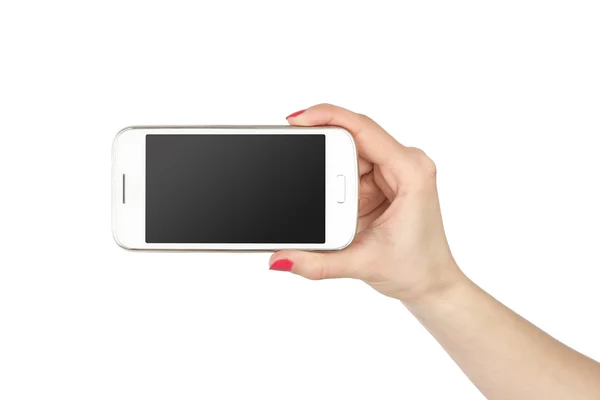 Woman showing white smartphone in hand. Isolated background. Phone with pure black gradient screen. — Stock Photo, Image