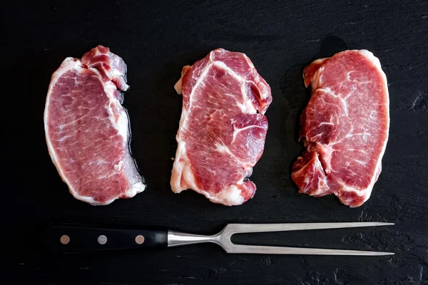 Raw pork steaks — Stock Photo, Image