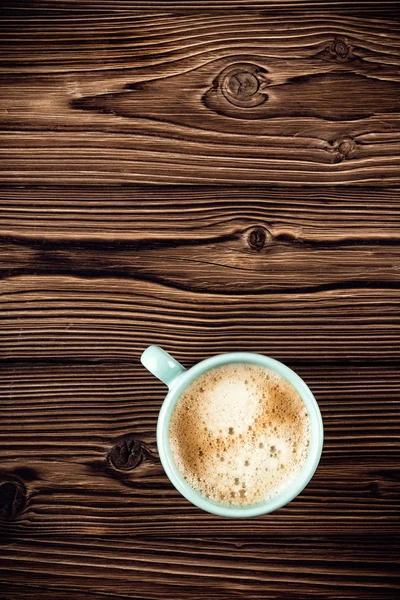 Tazza di caffè su sfondo in legno vista dall'alto — Foto Stock
