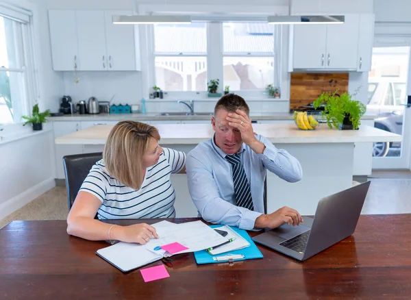 COVID-19 Outbreak impact on housing finance. Worried and stressed couple not able to pay bills, mortgage or rent payments due to loss of income amid coronavirus impact in economy and job losses.