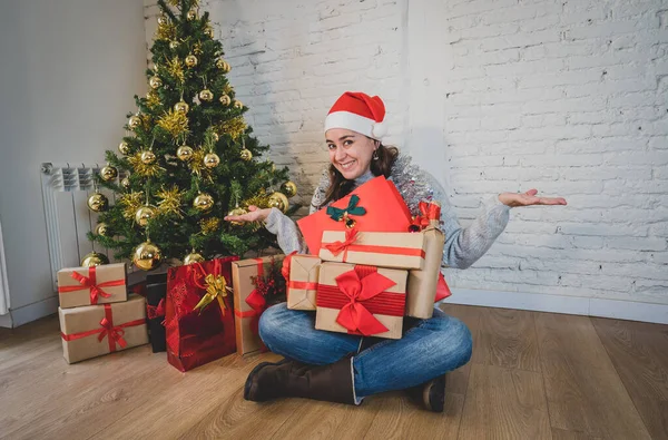 Happy woman celebrating Virtual christmas and new year home alone in lockdown. Webcam view portrait of woman on video call or virtual christmas party. Online celebrations and COVID-19 Outbreak.