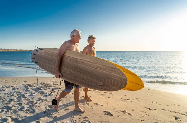 Two Mature Men Walking Surfboards Beautiful Beach Enjoying Paradise Retirement — Stock Photo, Image