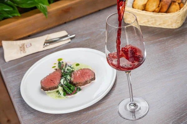 Steak with a glass of red wine — Stock Photo, Image