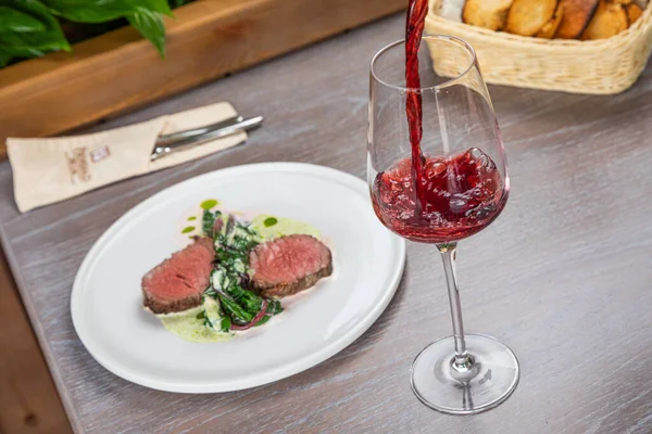 Steak with a glass of red wine — Stock Photo, Image