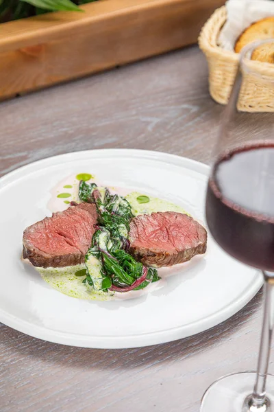 Steak with a glass of red wine — Stock Photo, Image