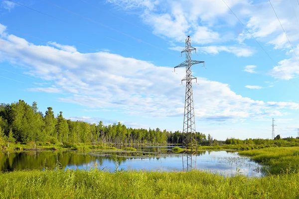 Landscape with the lake and a support of a power line at evening — Stock Photo, Image