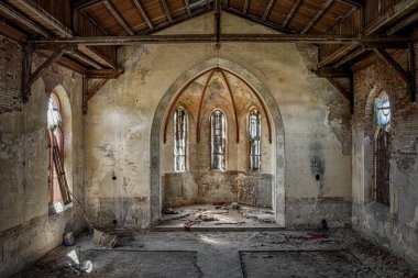 The hollow interior of an old Christian church clipart