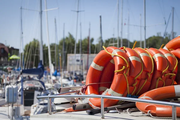 A lifebuoy for the safety of people in the harbor — Stock Photo, Image