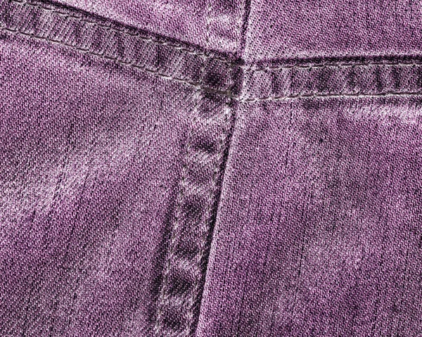 Fragment av violett jeans närbild — Stockfoto