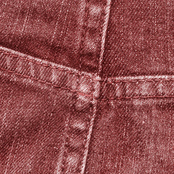 Fragment van rode jeans closeup — Stockfoto