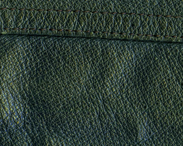 Green leather texture closeup,seam — Stock Photo, Image