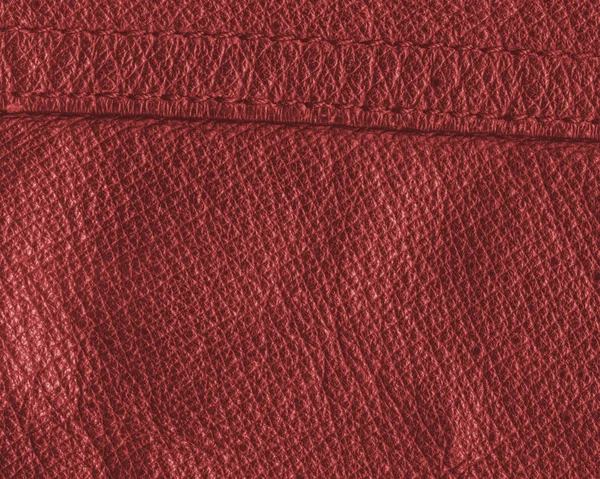 Rood lederen textuur close-up, naad — Stockfoto
