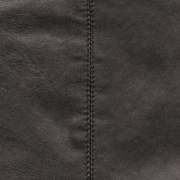 Bruin leder texture versierd met naad — Stockfoto