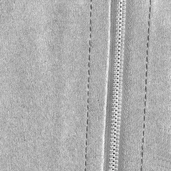 Valkoinen kangas rakenne, vetoketju, ompeleet — kuvapankkivalokuva