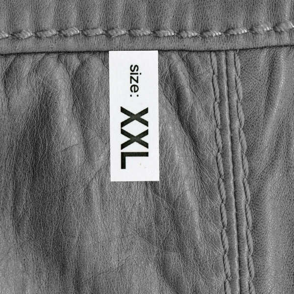 Textura de cuero gris o fondo con costuras, etiqueta — Foto de Stock