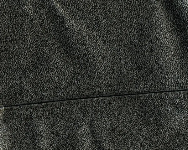 Black leather background, seam — Stock Photo, Image