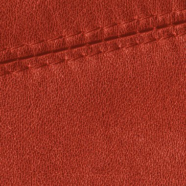 kırmızı deri arka plan dikişleri ile dekore edilmiştir.