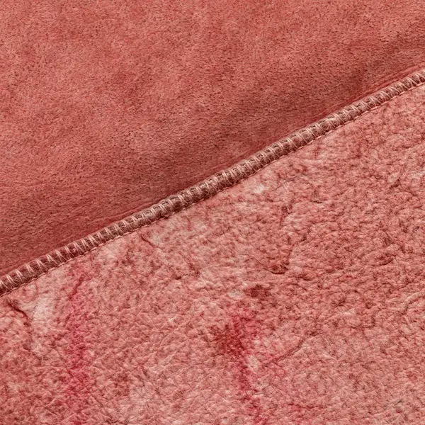 Painted red fragment of wrong side of sheepskin coat — Stock Photo, Image