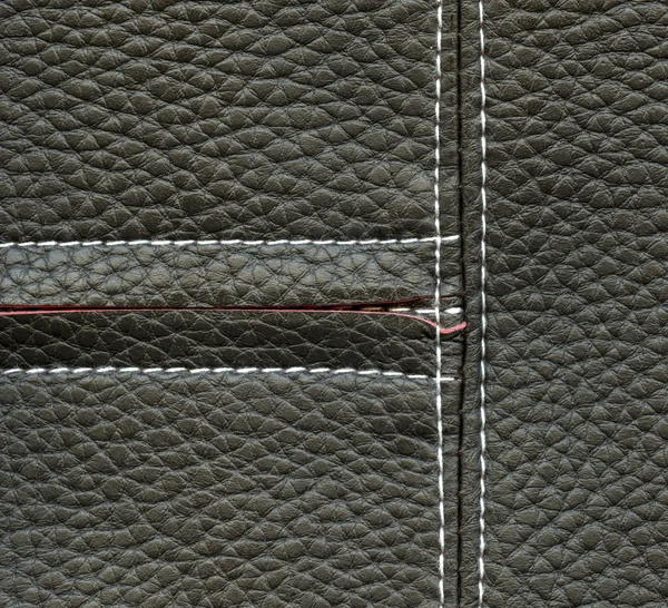 Fragmento de jaqueta feminina cinza como textura de couro — Fotografia de Stock