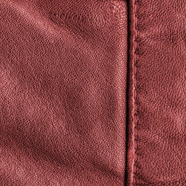 kırmızı deri doku closeup, dikişler. Arka plan olarak yararlı