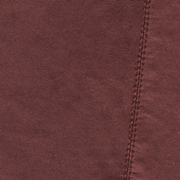 Red leather texture, seam. Useful for background — Stock Photo, Image