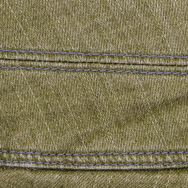 Fondo de jean gris-verde decorado con costuras — Foto de Stock