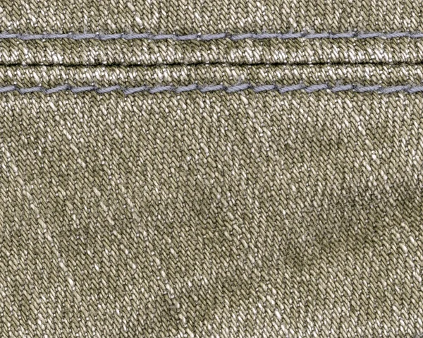 Светло-коричневый джинсовой фон, украшенный швом — стоковое фото