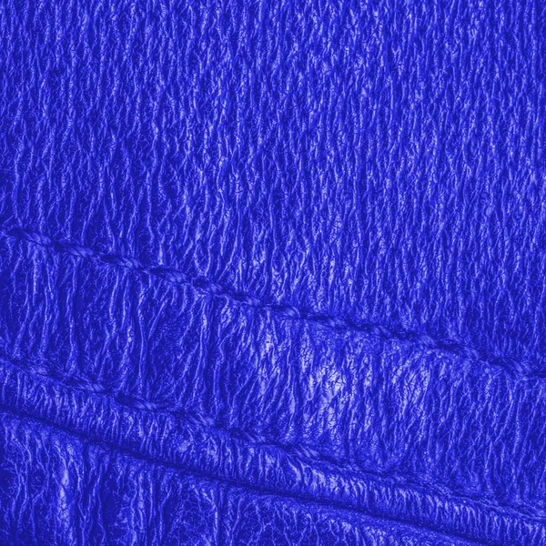 Textura de couro azul brilhante ou fundo, costuras — Fotografia de Stock