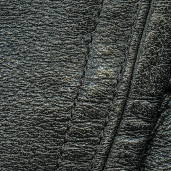 Czarne skórzane tekstury lub tła, szwami — Zdjęcie stockowe