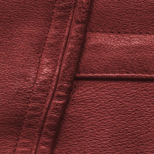 Ceket kırmızı deri arka plan olarak parçası — Stok fotoğraf