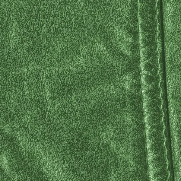Green leather texture decorated with seam — Stock Photo, Image