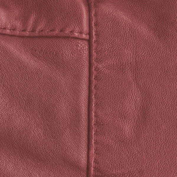 Red leather texture, seams. Useful as background — Stock Photo, Image