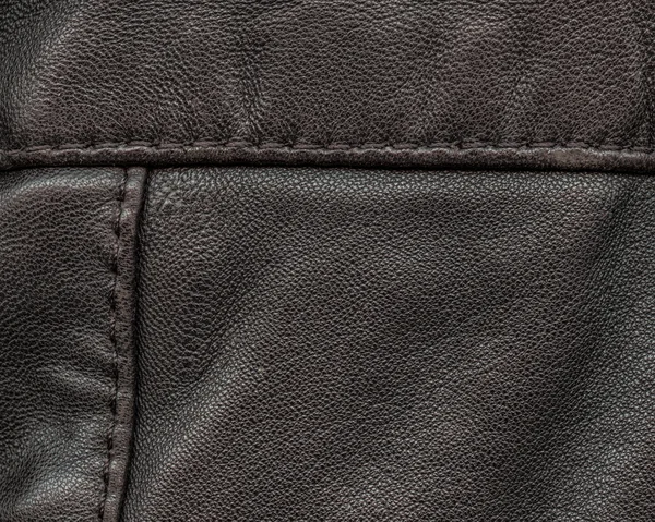 Ciemny brązowy skórzany tekstura zbliżenie — Zdjęcie stockowe