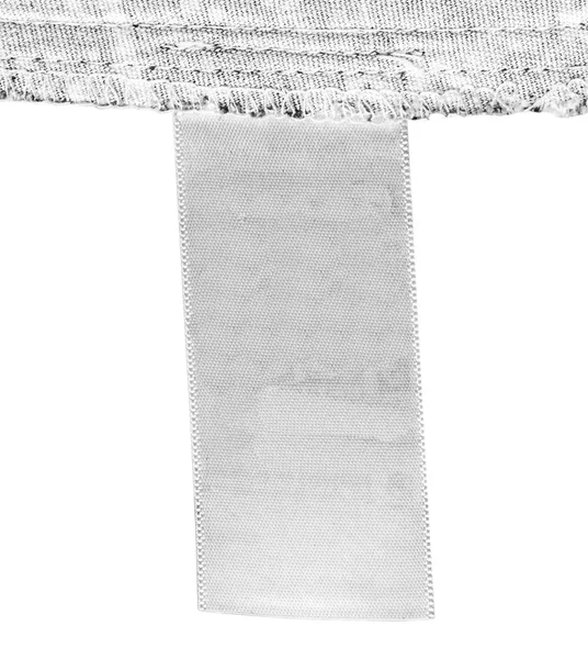 Etiqueta têxtil branca em branco. Útil para o seu texto — Fotografia de Stock