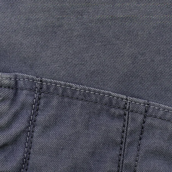 Grijs-blauwe jeans textuur, naden, steken — Stockfoto