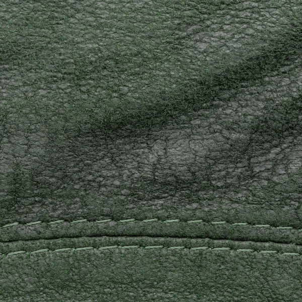Fond en cuir tanné vert foncé gros plan — Photo