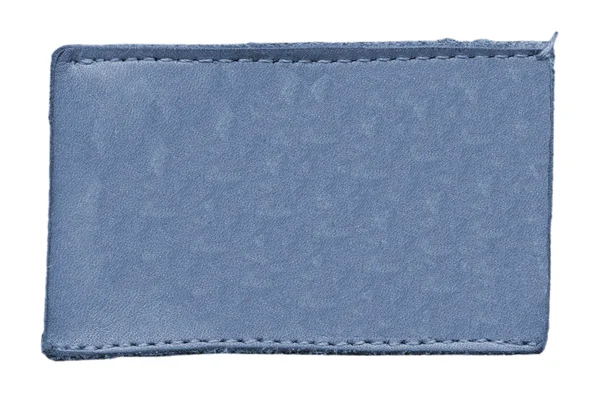 白で隔離される青い革ラベル — ストック写真