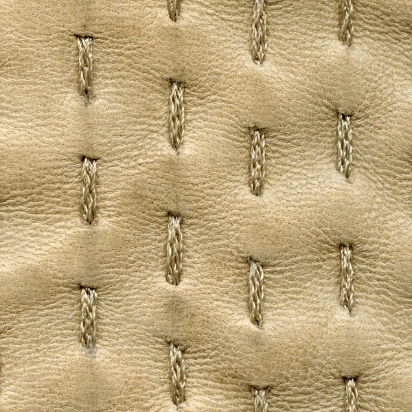 Beige leather texture decorated with stitches — Stock Photo, Image